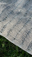 Close-up of handwoven organic cotton fabric texture